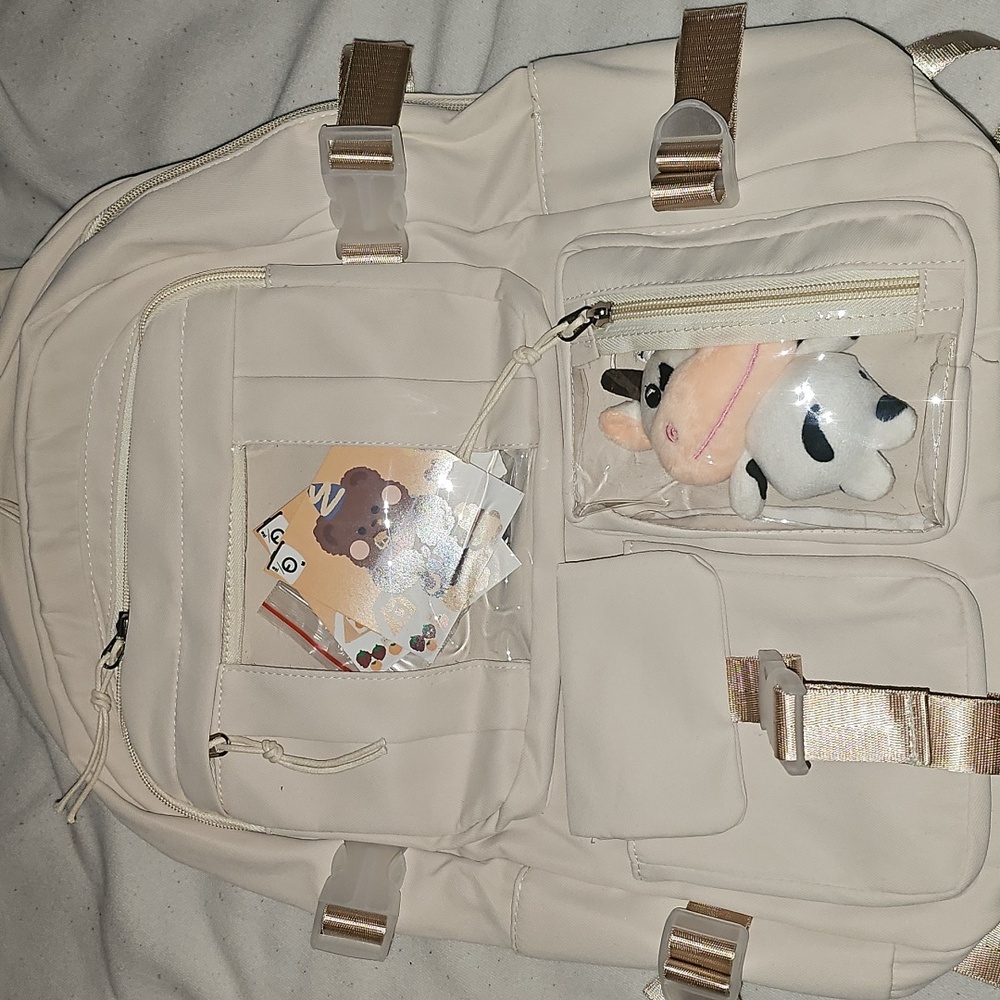 Cream Backpack with Plush Accessory